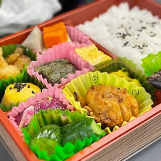 Lunch boxes, rice balls, and side dishes